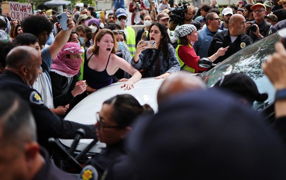 Pro-Palestine demonstrators argue with public safety officers at the University of Southern California (Getty Images)