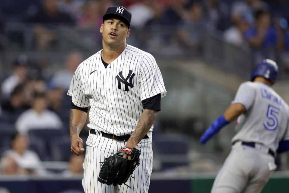 FILE - New York Yankees pitcher Frankie Montas reacts after giving up an RBI single to Toronto Blue Jays' George Springer during the second inning of a baseball game Thursday, Aug. 18, 2022, in New York. Montas needs shoulder surgery and will miss most or all of the New York Yankees’ season. (AP Photo/Adam Hunger, FIle)