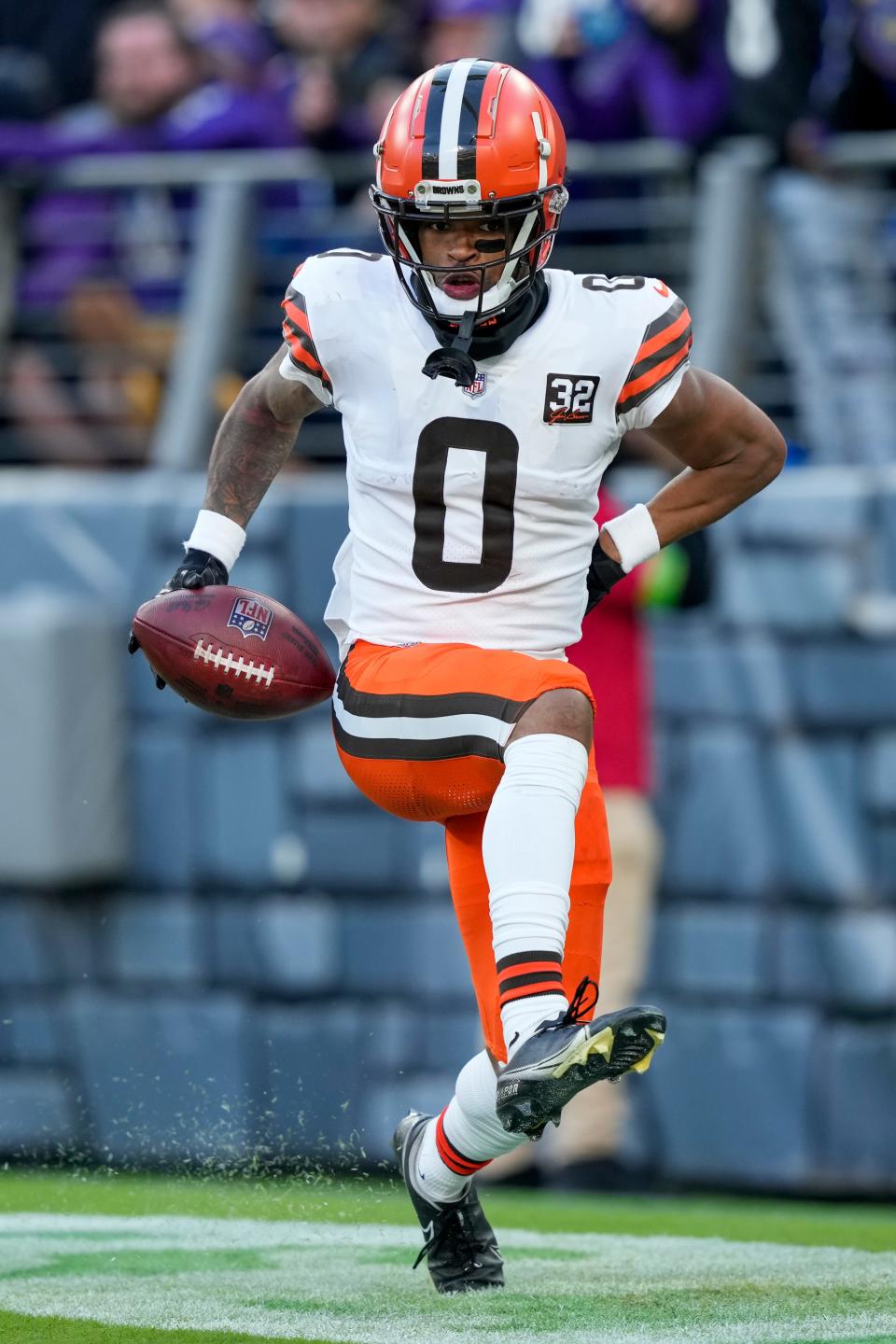 Cleveland Browns cornerback Greg Newsome celebrates after scoring on an interception return against the Baltimore Ravens on Sunday in Baltimore.