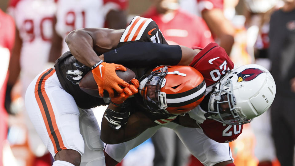 Arizona Cardinals cornerback Marco Wilson (20) tackles Cleveland Browns wide receiver Donovan Peoples-Jones (11) after a pass reception during the first half of an NFL football game, Sunday, Oct. 17, 2021, in Cleveland. (AP Photo/Ron Schwane)