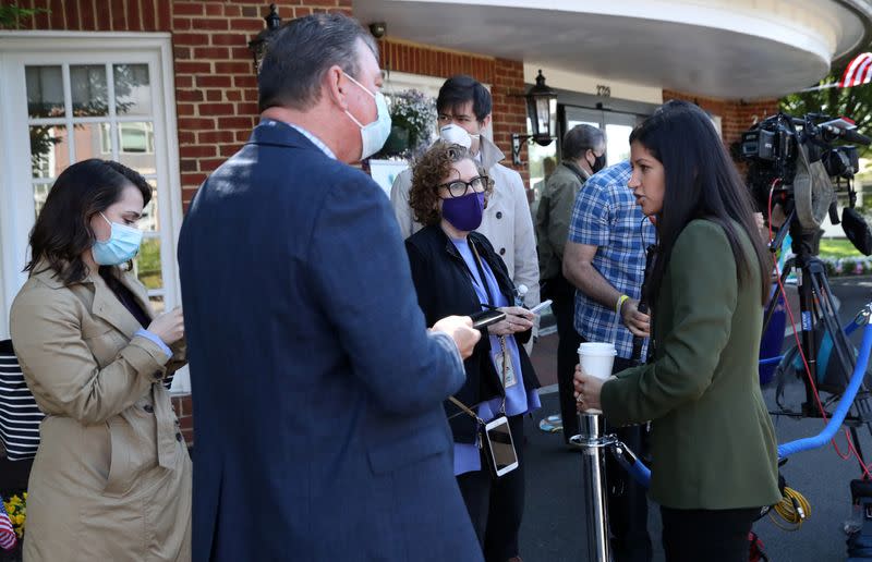 FILE PHOTO: U.S. Vice President Pence unloads boxes of PPE provided by FEMA to the Woodbine Rehabilitation and Healthcare Center in Alexandria, Virginia., U.S.