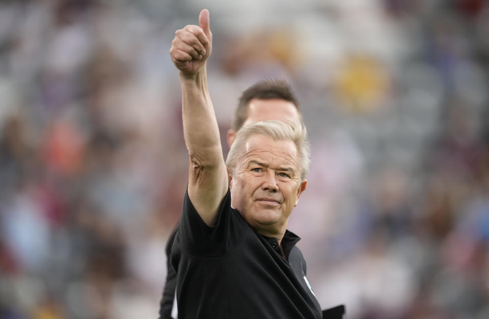 Minnesota United head coach Adrian Heath gestures to fans in the first half of an MLS soccer match against the Colorado Rapids, Saturday, Aug. 6, 2022, in Commerce City, Colo. (AP Photo/David Zalubowski)