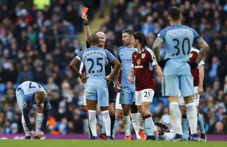 Britain Football Soccer - Manchester City v Burnley - Premier League - Etihad Stadium - 2/1/17 Manchester City's Fernandinho is shown a red card by referee Lee Mason Action Images via Reuters / Jason Cairnduff Livepic