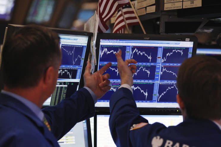 Traders work on the floor of the New York Stock Exchange.