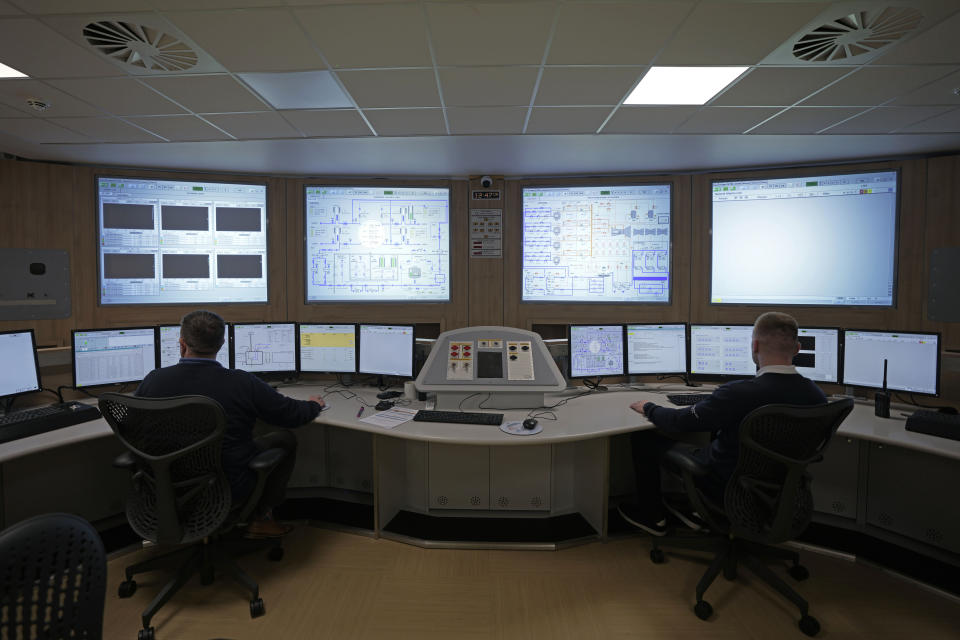 Workers practice at the control center training area at Hinkley Point C nuclear power station in Somerset, England, Tuesday, Oct. 11, 2022. Hinkley Point C is set to be one of the the biggest power stations in Britain and will generate 7% of the country’s electricity. (AP Photo/Kin Cheung)