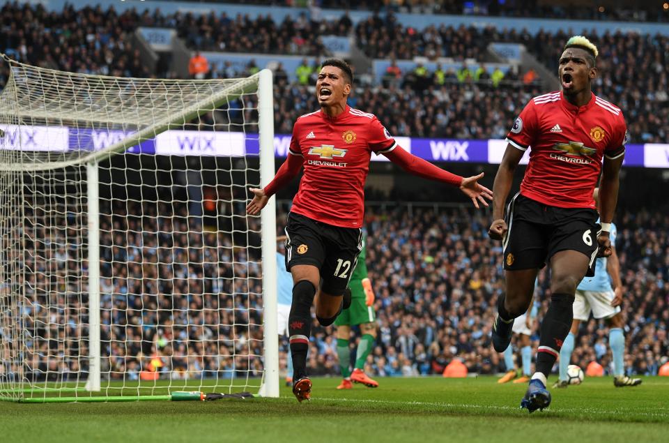 Chris Smalling (left) and Paul Pogba celebrate United’s stunning comeback