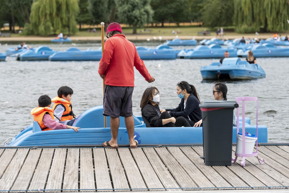 People are seen on paddle boats on London�s Serpentine Lake. (Photo by Dave Rushen / SOPA Images/Sipa USA)