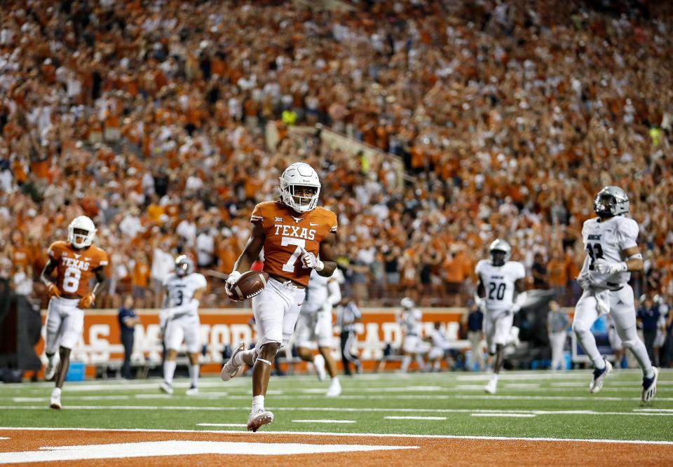 AUSTIN, TEXAS - SEPTEMBER 18: Keilan Robinson #7 of the Texas Longhorns rushes for a touchdown in the second half against the Rice Owls at Darrell K Royal-Texas Memorial Stadium on September 18, 2021 in Austin, Texas. (Photo by Tim Warner/Getty Images)