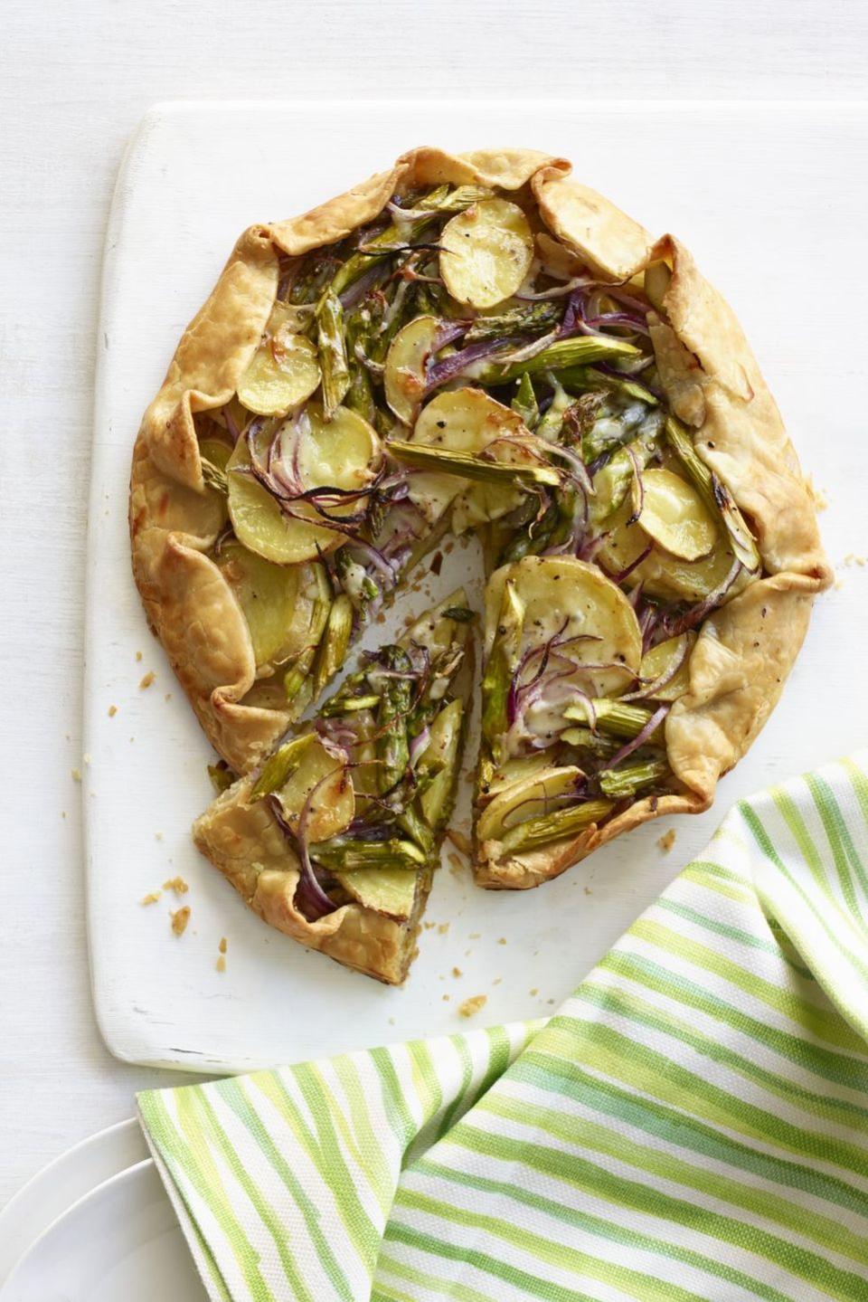 <p>Whether you serve it as an appetizer or a side dish, this simple galette is sure to be a crowd-pleaser. </p><p><strong><em><a href="https://www.womansday.com/food-recipes/food-drinks/recipes/a12863/asparagus-potato-spinach-galette-recipe-wdy0514/" rel="nofollow noopener" target="_blank" data-ylk="slk:Get the Asparagus and Potato Galette recipe;elm:context_link;itc:0;sec:content-canvas" class="link ">Get the Asparagus and Potato Galette recipe</a>. </em></strong></p>