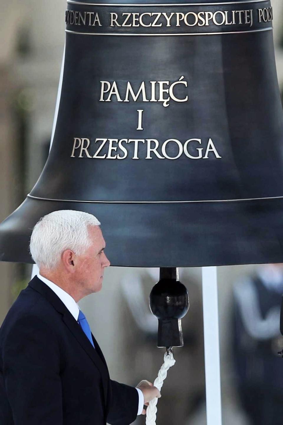 Vice President Mike Pence rings the Bell of Memory and Warning during a ceremony at Pilsudski Square in Warsaw, Poland, on Sept. 1, 2019. The ceremony marked the 80th anniversary of start of World War II.