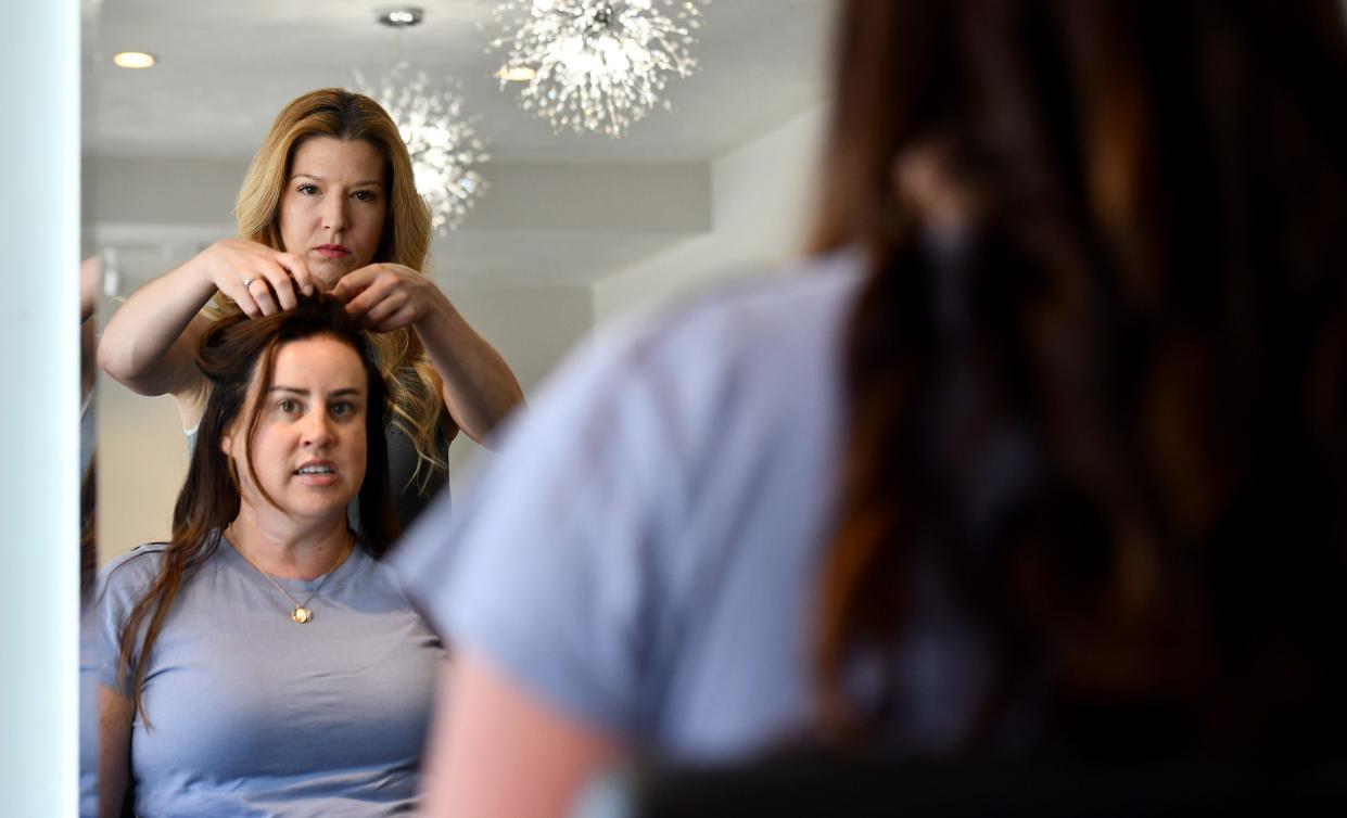 592 Salon hairdresser Katie Gustavsson styles hudson resident Liz Curtis' hair.