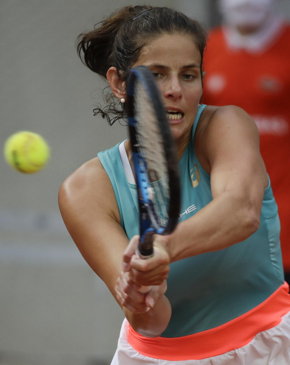 Germany's Julia Georges plays a shot against Alison Riske of the U.S. in the first round match of the French Open tennis tournament at the Roland Garros stadium in Paris, France, Tuesday, Sept. 29, 2020. (AP Photo/Alessandra Tarantino)