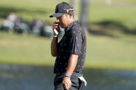 Hideki Matsuyama, of Japan, reacts to missing his birdie putt on the 14th green during their fourball match at the Presidents Cup golf tournament at the Quail Hollow Club, Friday, Sept. 23, 2022, in Charlotte, N.C. (AP Photo/Chris Carlson)