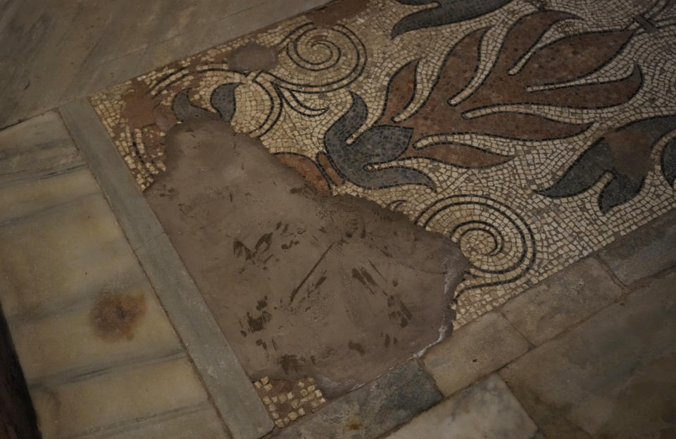 A view of the damaged St. Mark's Basilica's mosaic floor, in Venice, Italy, Thursday, Oct. 7, 2021. Lashing winds that pushed 1.87 meters (nearly 6 feet 2 inches) of water into Venice in November 2019 and ripped the lead tiles off St. Mark's Basilica for the first time ever shocked Venetians with the city's second-worst flood in history, but it was the additional four exceptional floods over the next six weeks that triggered fears about the impact of worsening climate change. (AP Photo/Antonio Calanni)