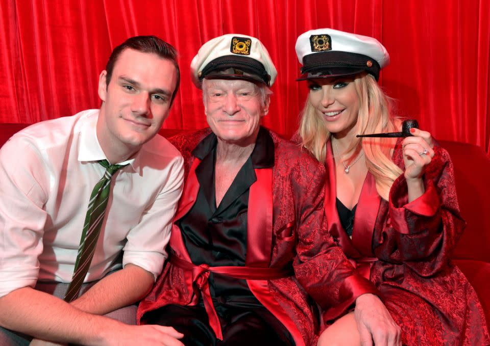 Hugh with his wife and son at the 2016 Playboy Halloween Party. Source: