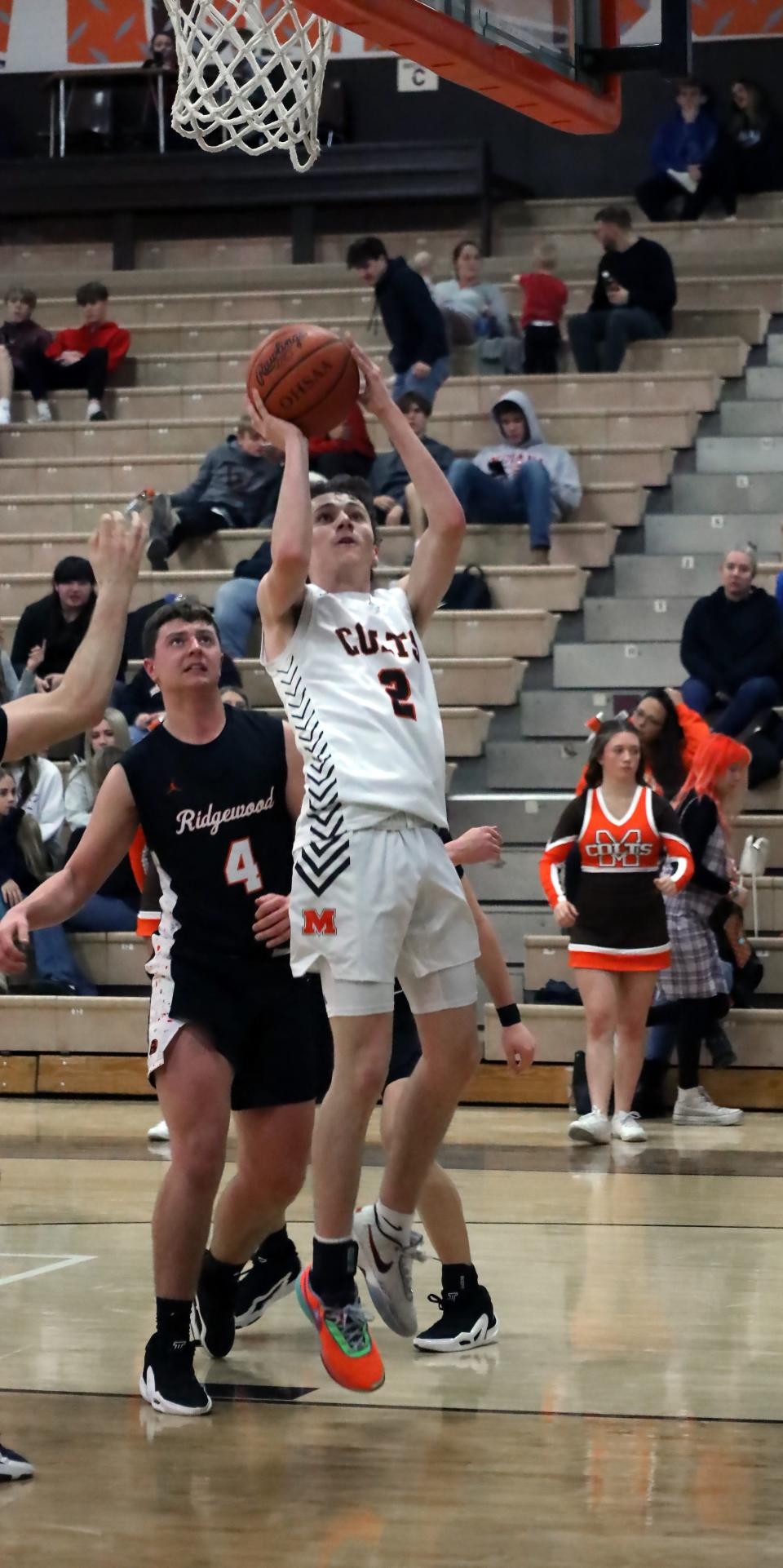 Meadowbrook's Masyn Campbell (2) puts up a shot during the Colts versus Generals basketball game Tuesday evening at Meadowbrook High School.