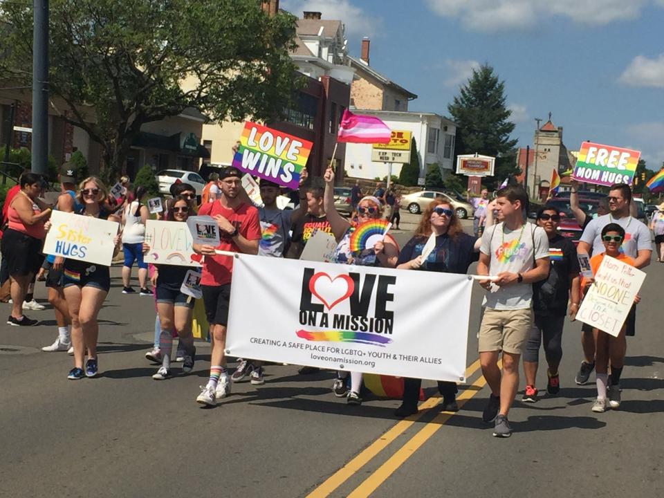 People representing Love on a Mission march in a previous parade for Mansfield' Pride celebration.