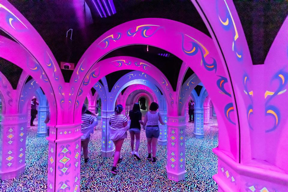 Celsey Copeland, and Sophie and Lilli McDonald try to navigate their way around the maze at Emerald Coast Mirror Maze & Laser Craze in Pier Park.