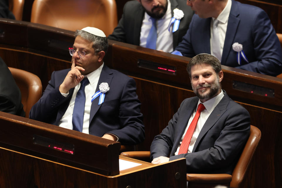 FILE - Israeli right wing Knesset member Itamar Ben Gvir, left, and Bezalel Smotrich look on during the swearing-in ceremony for Israeli lawmakers at the Knesset, Israel's parliament, in Jerusalem, Tuesday, Nov. 15, 2022. (Abir Sultan/Pool Photo via AP, File)