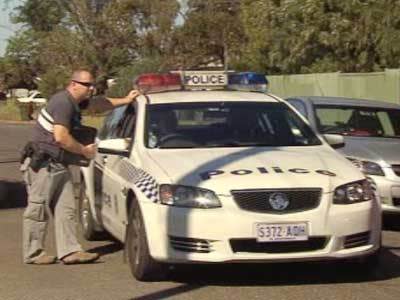 <p>Police investigating the Davoren Park home invasion.</p>