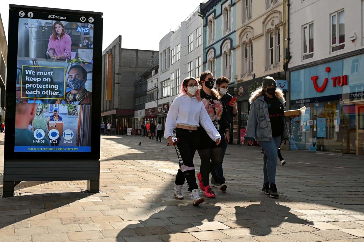 Pedestrians and shoppers wear face masks in north-east England: AFP via Getty Images