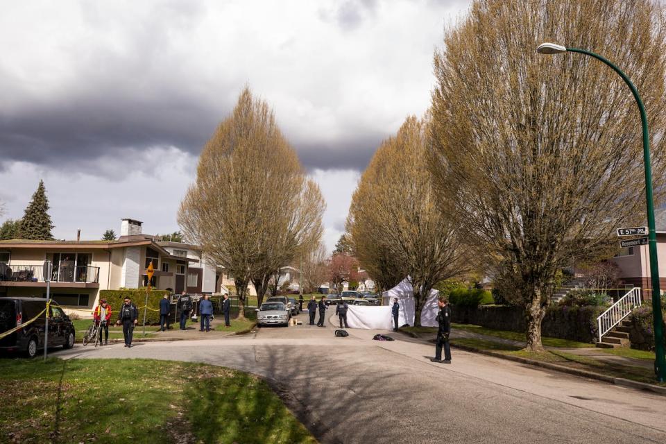 Vancouver Police officers investigate the death of a person who was found in the area near Fraserview Golf Course in Vancouver, B.C on Wednesday April 3, 2024. 