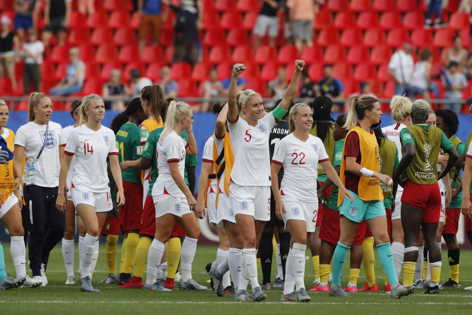 England players celebrate at the end of the Women's World Cup round of 16 soccer match between England and Cameroon at the Stade du Hainaut stadium in Valenciennes, France, Sunday, June 23, 2019. England beat Cameroon 3-0. (AP Photo/Michel Spingler)