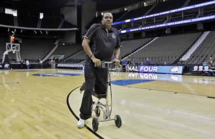 Georgia State head coach Ron Hunter wheels himself off the court after practice at the NCAA college basketball tournament, Wednesday, March 18, 2015, in Jacksonville, Fla. (AP Photo/Chris O&#39;Meara)