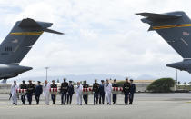 <p>Military members carry transfer cases from a C-17 at a ceremony marking the arrival of the remains believed to be of American service members who fell in the Korean War at Joint Base Pearl Harbor-Hickam in Hawaii, Wednesday, Aug. 1, 2018. (Photo: Susan Walsh/AP) </p>