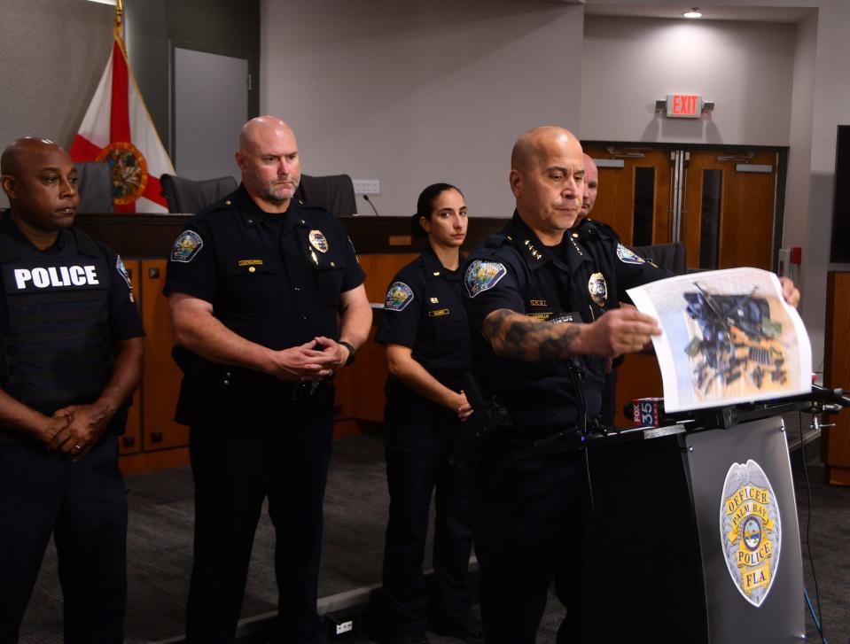 Palm Bay Police Chief Mariano Augello, at a Monday afternoon press conference, held up a photo of the weapons that Brandon Kapas had in his car.