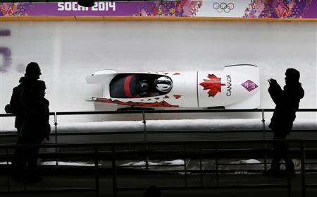 Canada's pilot Justin Kripps (front) and Bryan Barnett speed down the track during the two-man bobsleigh event at the 2014 Sochi Winter Olympics, at the Sanki Sliding Center in Rosa Khutor February 17, 2014. REUTERS/Murad Sezer