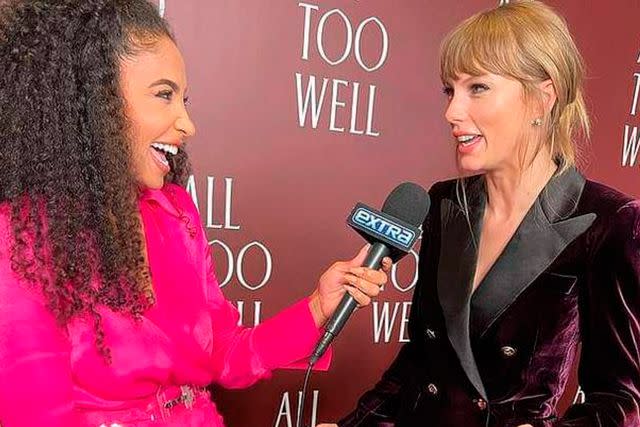 <p>Extra</p> Cheslie Kryst interviewing Taylor Swift for Extra, November 2021.