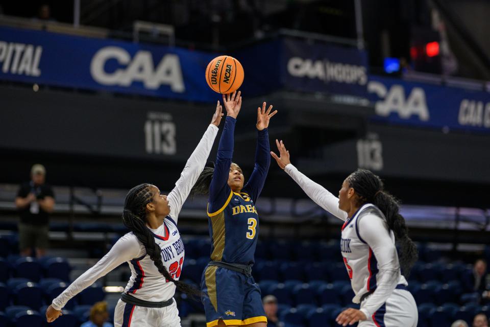 Drexel guard Amaris Baker launches a shot over Stony Brook defenders during the Coastal Conference Tournament championship game in Washington. Baker is Drexel's leading scorer, averaging 11.8 points.