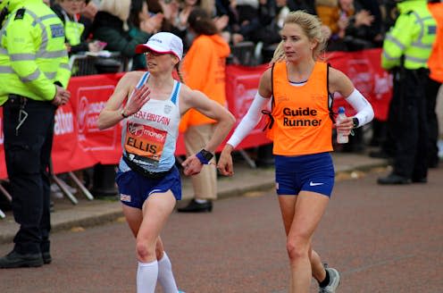 <span class="caption">GB parasport athlete Charlotte Ellis (left) finishing the 2019 London Marathon with her guide runner.</span> <span class="attribution"><a class="link " href="https://www.shutterstock.com/image-photo/londonuk-042819-virgin-money-london-marathon-1636005100" rel="nofollow noopener" target="_blank" data-ylk="slk:Dave Smith/Shutterstock;elm:context_link;itc:0;sec:content-canvas">Dave Smith/Shutterstock</a></span>