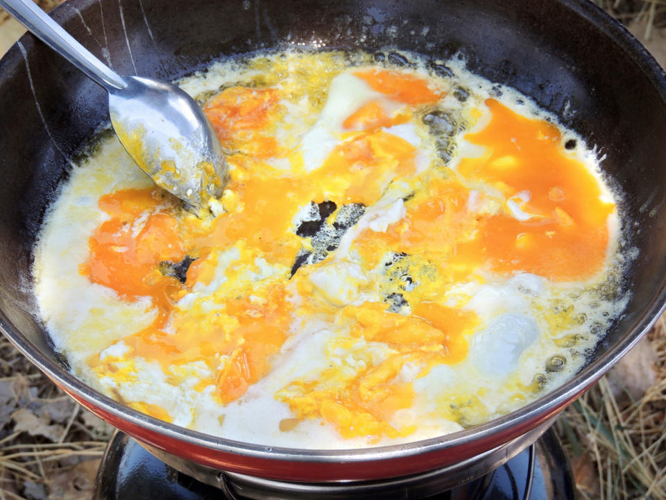 Scrambling eggs.