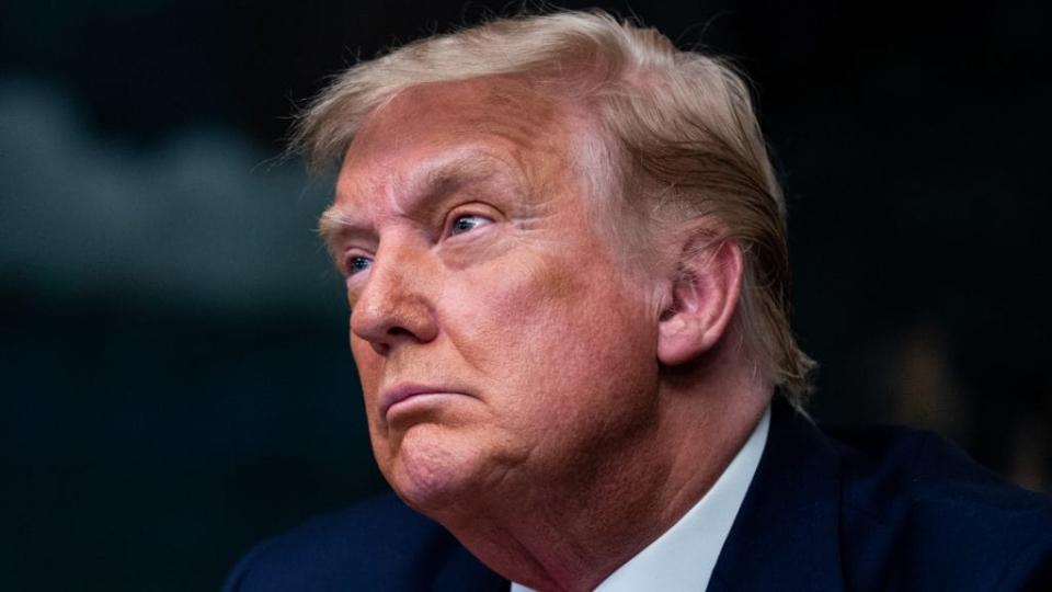 President Donald Trump speaks in the Diplomatic Room of the White House on Thanksgiving after making the traditional call to members of the military stationed abroad through video teleconference. (Photo by Erin Schaff – Pool/Getty Images)