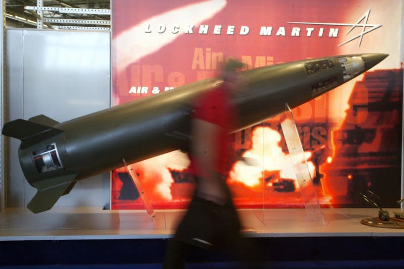 A visitor walks past a US made Lockheed Martin army surface to surface missile on the opening day of the Eurosatory international exhibition for Land and Land-air Defene in Villepinte, north of Paris, June 12, 2006. The show is to run until June 16. (UPI Photo/Eco Clement)