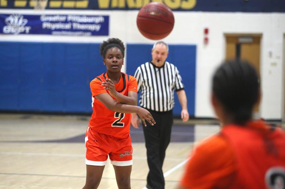 Beaver Falls Taylor Pullen (2) passes the ball after dribbling down the court during the first half against Hopewell Monday night at Hopewell High School.