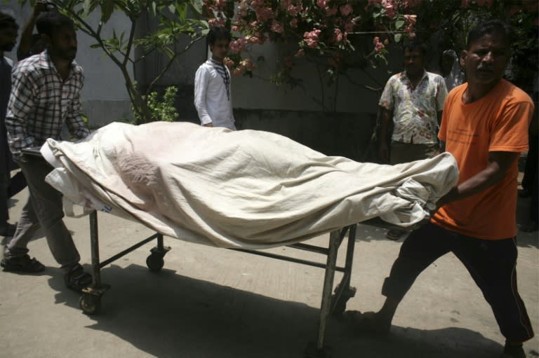 Medics move a trolley carrying the body of murdered gay rights activist Mahbub Tonoy at a hospital in Dhaka on April 26, 2016