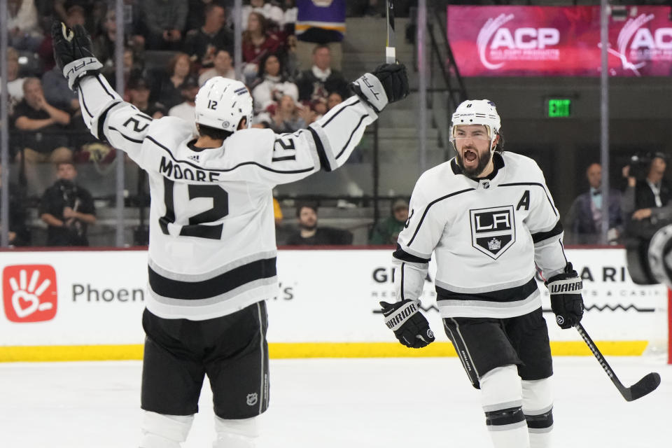 Los Angeles Kings defenseman Drew Doughty celebrates with center Trevor Moore (12) after scoring a goal against the Arizona Coyotes during the third period of an NHL hockey game Friday, Oct. 27, 2023, in Tempe, Ariz. (AP Photo/Rick Scuteri)