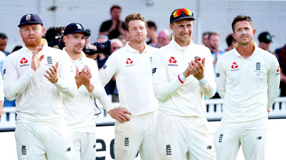 Seen here, England's players watch the presentation as Australia is awarded the Ashes trophy.