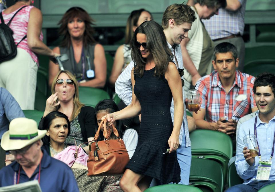 Pippa Middleton, sister of Catherine, Duchess of Cambridge, arrives for a semifinal between Spanish player Rafael Nadal and British player Andy Murray at at the Wimbledon Tennis Championships at the All England Tennis Club, in southwest London on July 1, 2011. AFP PHOTO / GLYN KIRK RESTRICTED TO EDITORIAL USE (Photo credit should read GLYN KIRK/AFP/Getty Images)