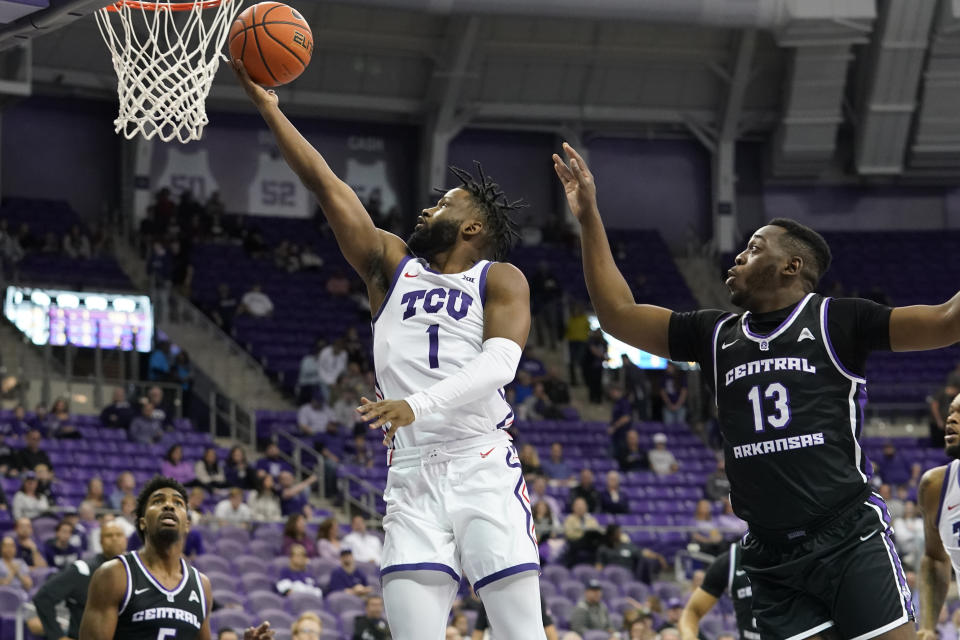TCU guard Mike Miles Jr. (1) shoots against Central Arkansas guard Eddy Kayouloud (13) during the first half of an NCAA college basketball game in Fort Worth, Texas, Wednesday, Dec. 28, 2022. (AP Photo/LM Otero)