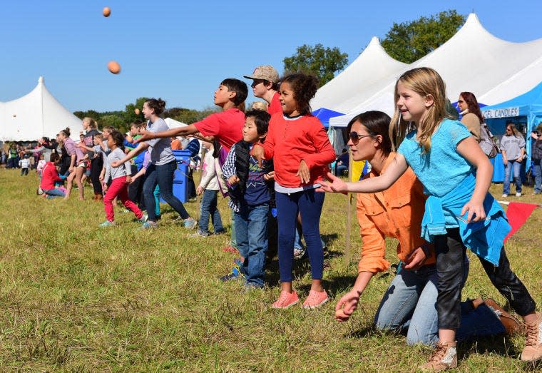 The egg toss was among the popular games at the 2019 Harvest Fair at Norman Bird Sanctuary in Middletown.