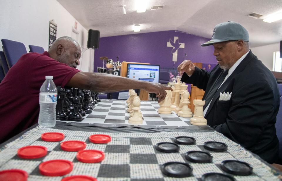 Norman Repass, left, teaches Anthony Woodward how to play chess during a free chess day put on by the nonprofit chess mentorship program Every Move Counts at the New Spirit Missionary Baptist Church in south Stockton on June, 24, 2023.