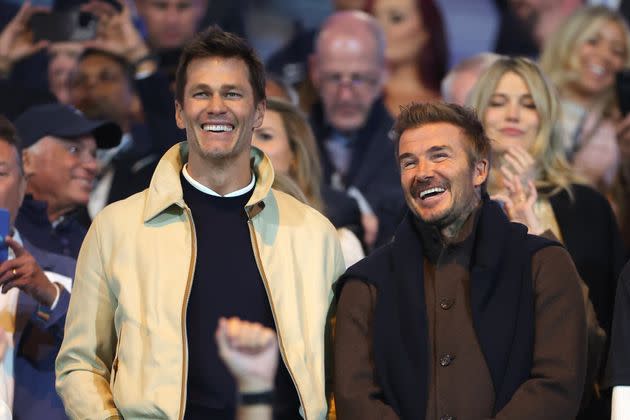 Tom Brady and David Beckham watch the match between Birmingham City and Wrexham on Monday.