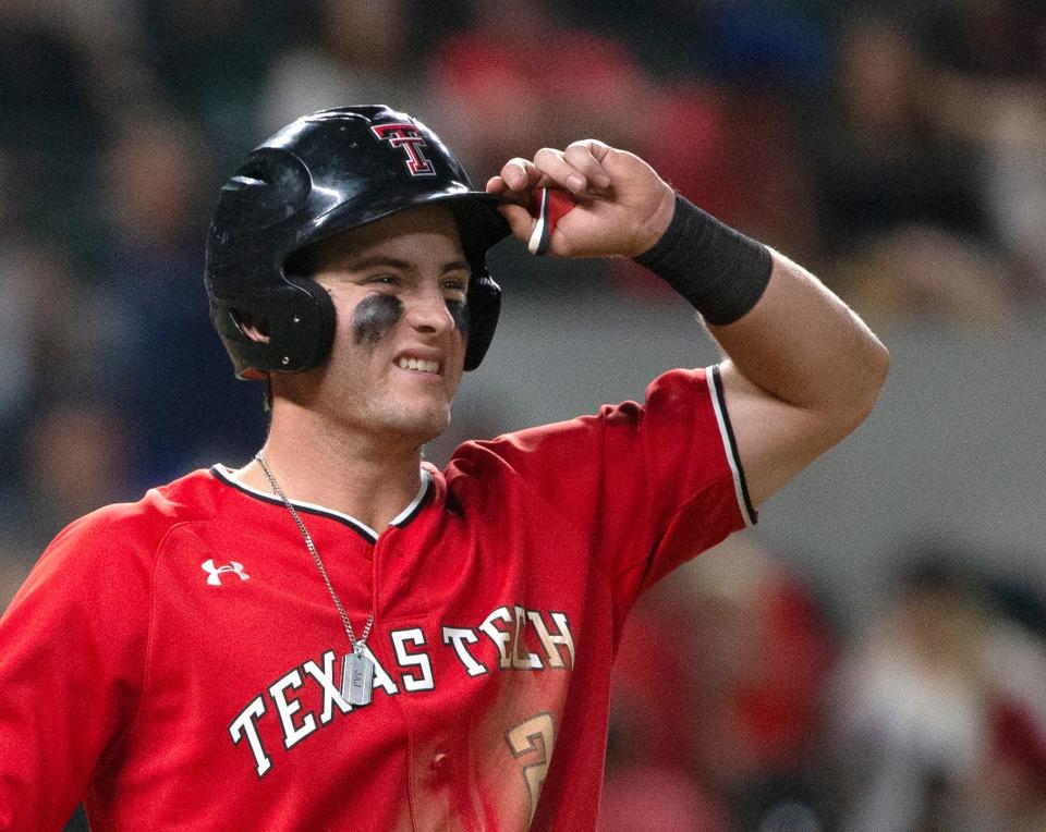 Texas Tech's infielder Jace Jung (2) reacts to being hit by a pitch against Oklahoma in the second-round Big 12 tournament game, Thursday, May 26, 2022, at Globe Life Field in Arlington. Oklahoma won, 6-3.