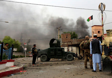 Afghan security forces keep watch during blasts and gunbattle at the site in Jalalabad city, Afghanistan May 13, 2018.REUTERS/Parwiz