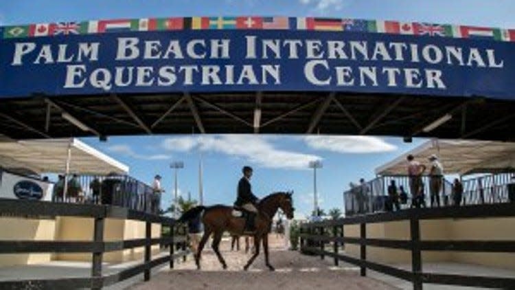 Alison Slott waits to compete in the Holiday Finale at the Palm Beach International Equestrian Center in this 2013 image in Wellington. Olympians, adult amateurs, juniors, and children compete in show jumping and dressage.