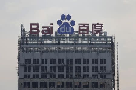A logo of Baidu is seen at the top of a building under construction in Wuhan, Hubei province, August 31, 2012. REUTERS/Stringer